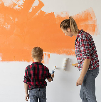 woman_child_painting_wall